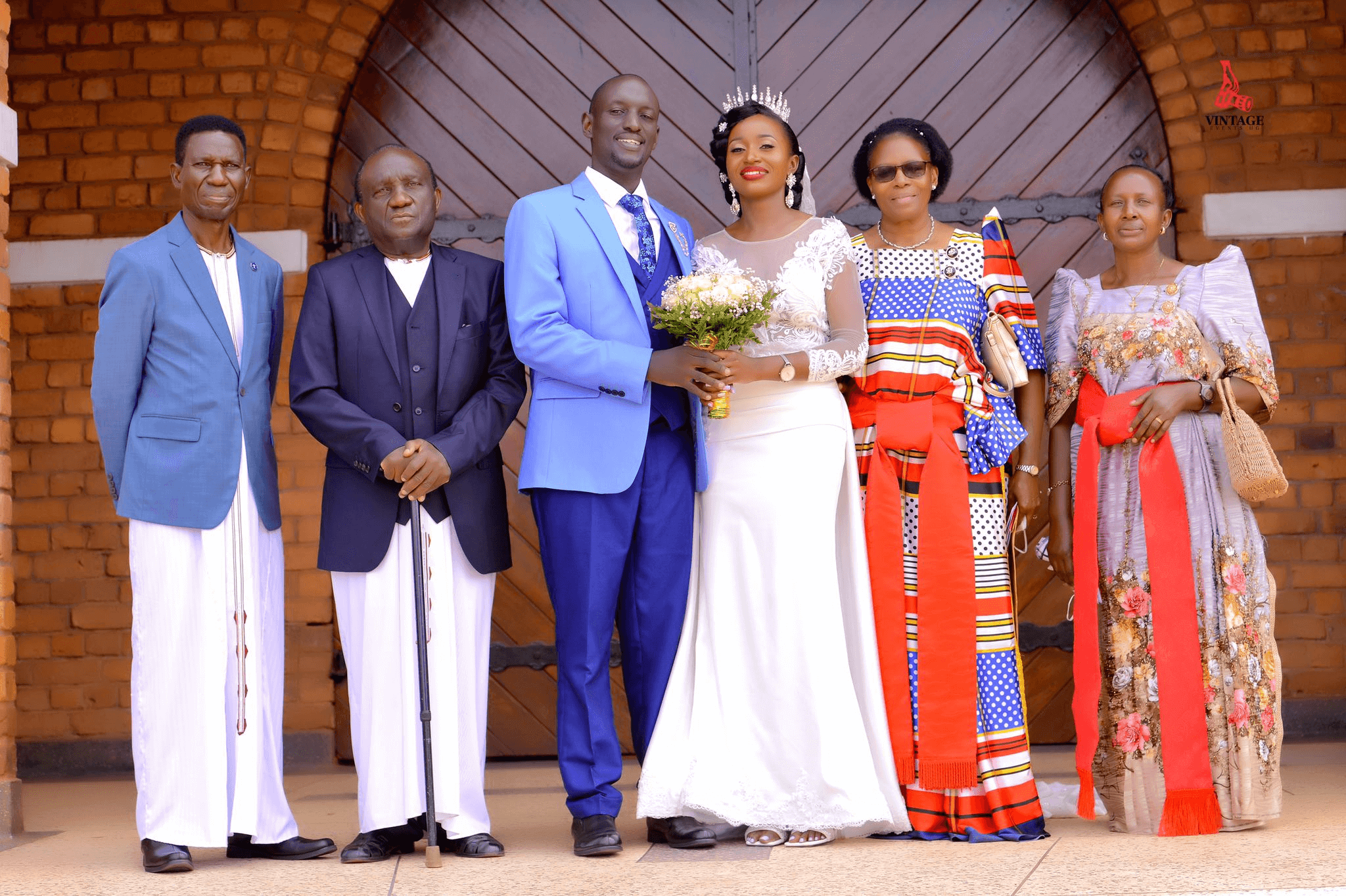 couple and relatives at a wedding ceremony by vintage media and events